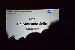 Folie mit Preisverkündigung 